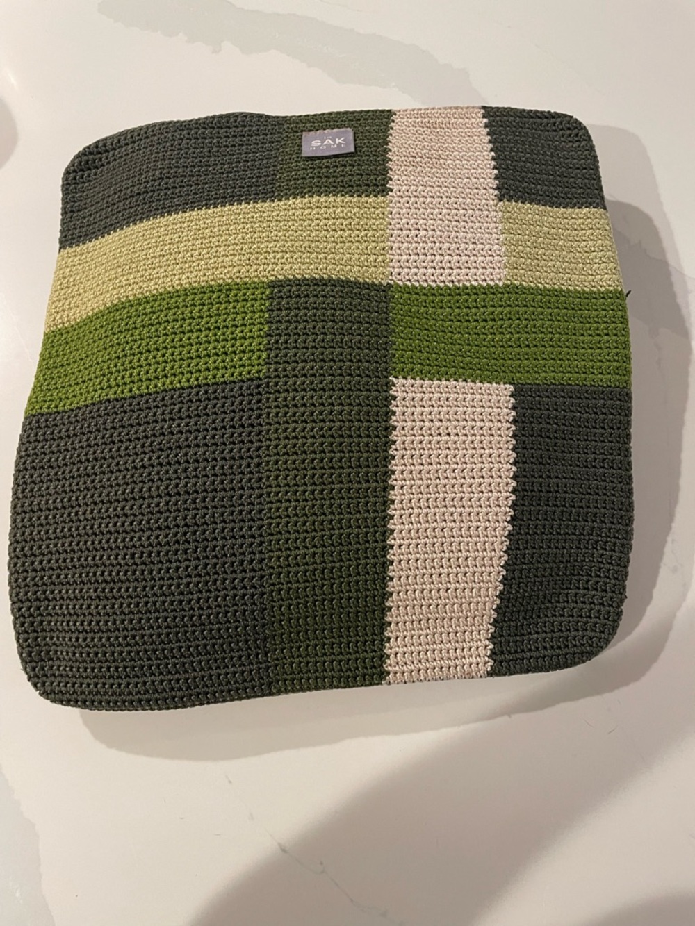 The Sak Crochet Colorblock Pouch in Olive, Bright Green & Cream